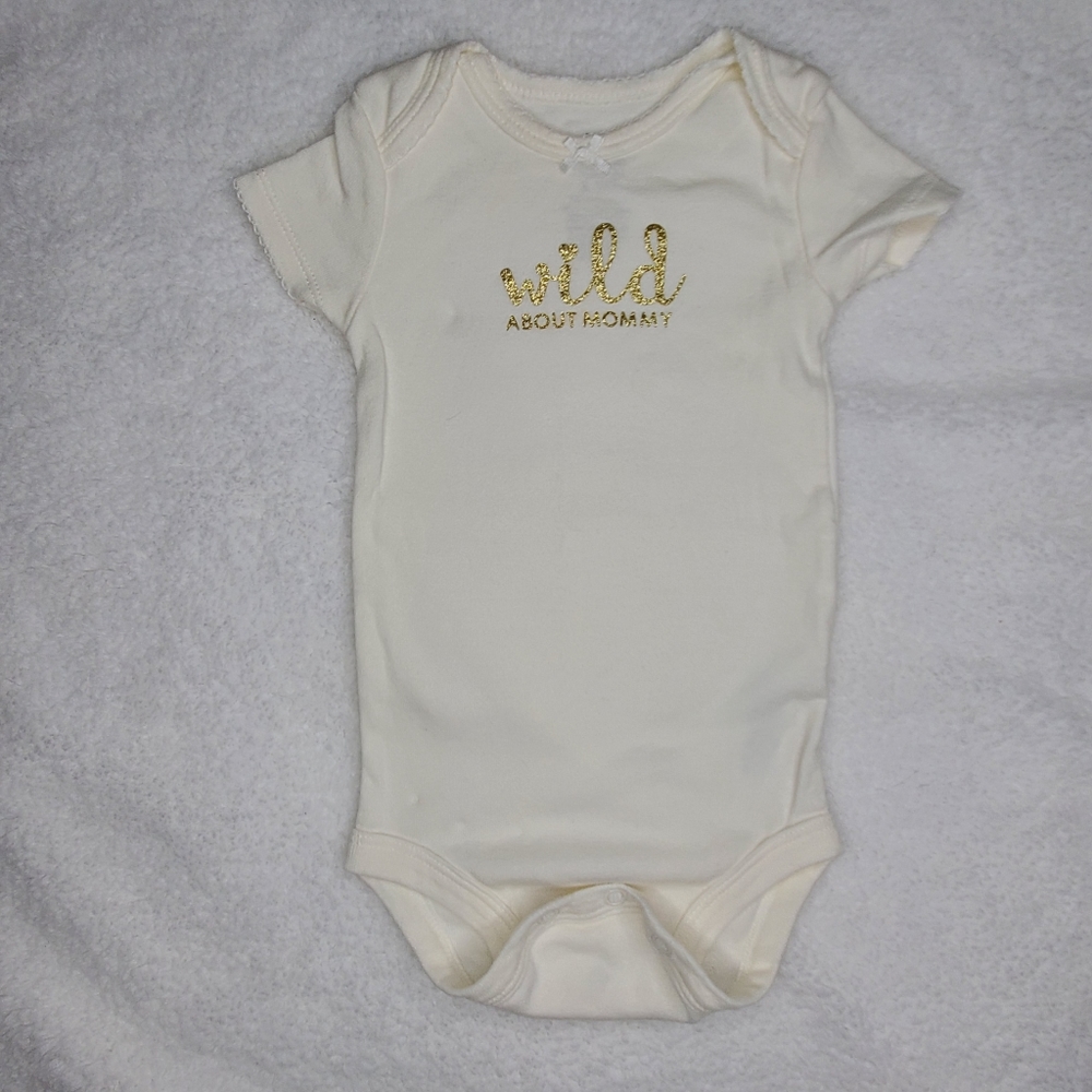 White onesie with gold lettering